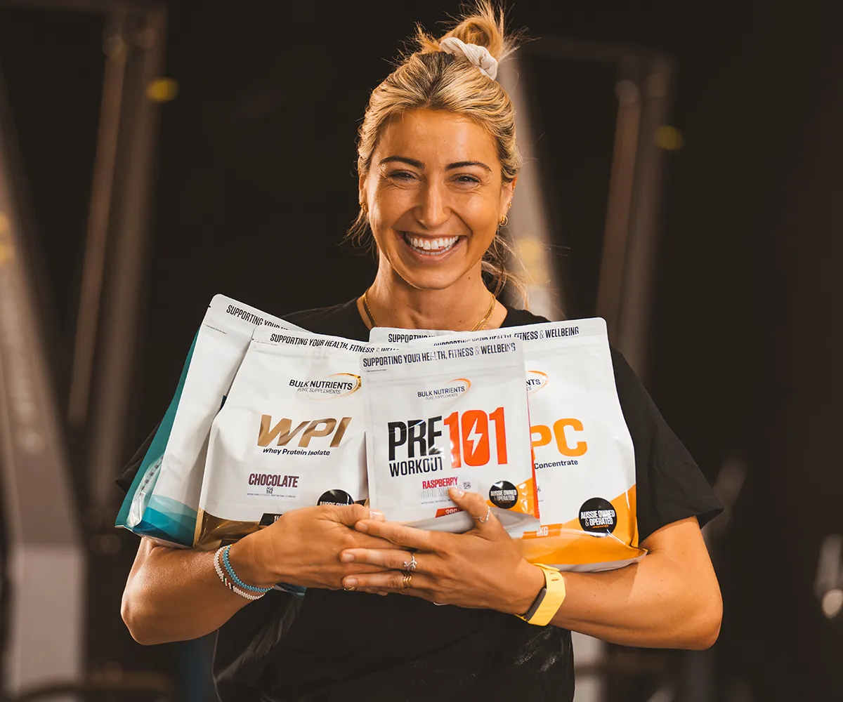 woman at gym holding Bulk Nutrients WPI and other products